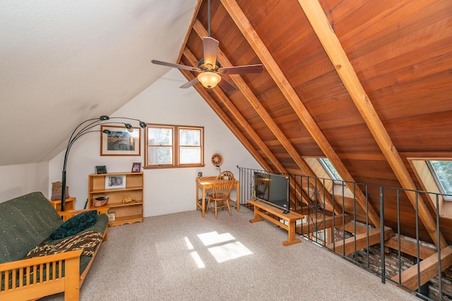 interior space with vaulted ceiling with beams, a ceiling fan, and an upstairs landing