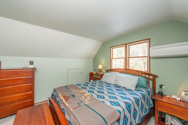 bedroom with a wall unit AC and lofted ceiling