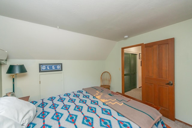 carpeted bedroom with lofted ceiling