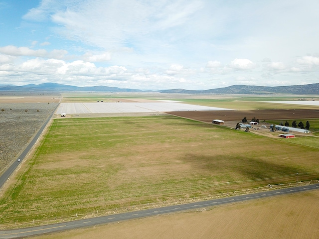 exterior space with a rural view and a mountain view