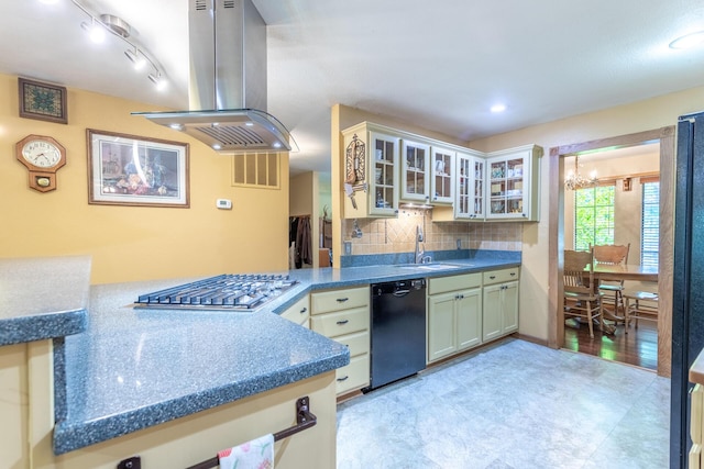 kitchen featuring an inviting chandelier, a sink, stainless steel gas cooktop, black dishwasher, and island exhaust hood