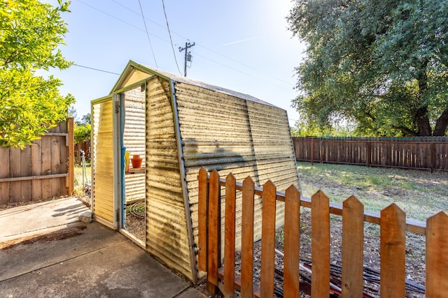 view of shed with a fenced backyard