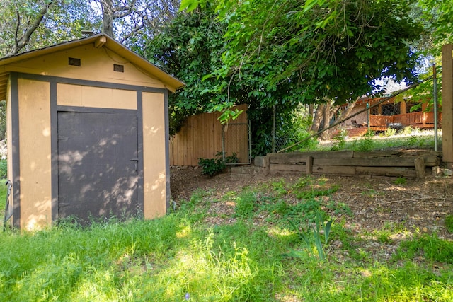 view of shed with fence