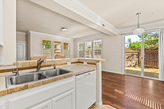 kitchen with white dishwasher, dark wood finished floors, a sink, ornamental molding, and white cabinetry