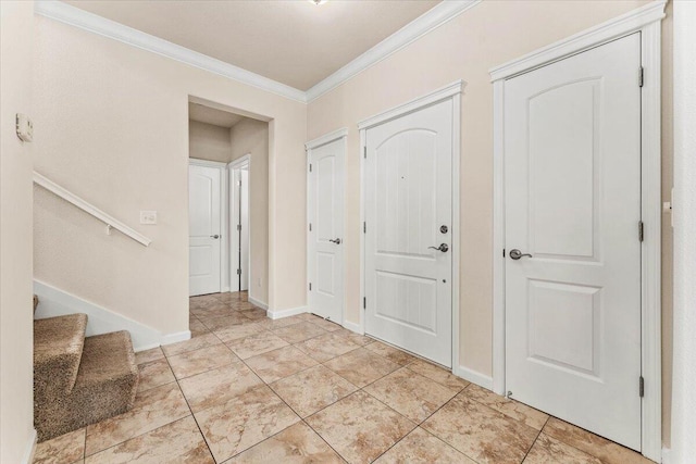 entryway with stairs, baseboards, ornamental molding, and light tile patterned floors