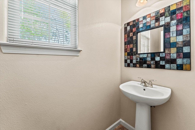 bathroom featuring baseboards