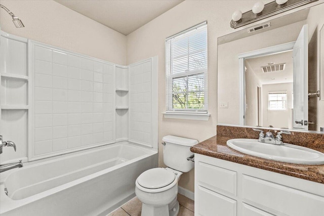 bathroom with visible vents, vanity, baseboards, toilet, and washtub / shower combination