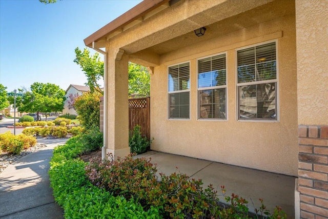 property entrance featuring stucco siding