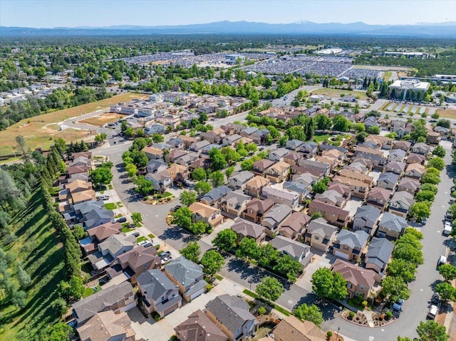 bird's eye view with a residential view and a mountain view