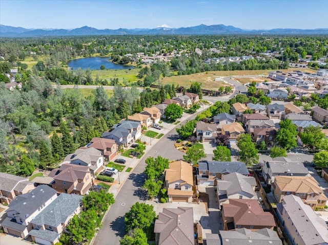 birds eye view of property featuring a residential view and a water and mountain view