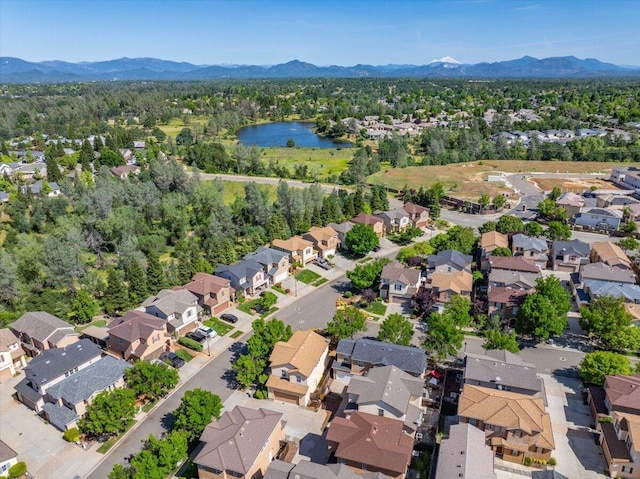 birds eye view of property with a residential view and a water and mountain view