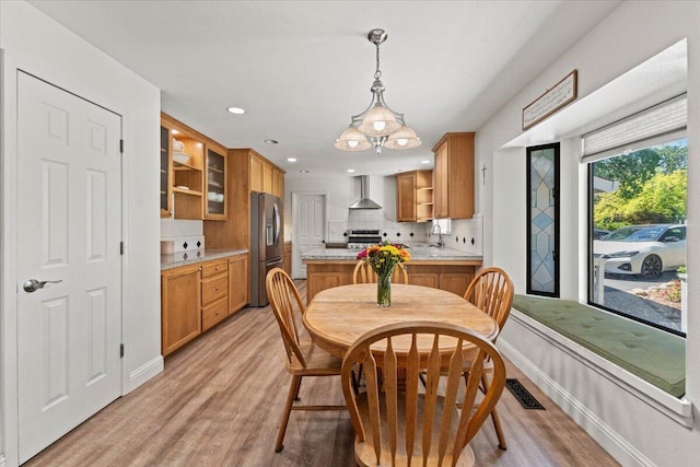dining area featuring recessed lighting, baseboards, visible vents, and light wood-type flooring