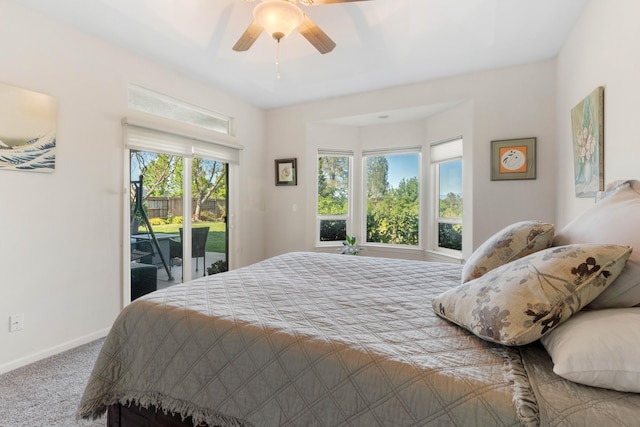 bedroom featuring access to outside, baseboards, ceiling fan, and carpet