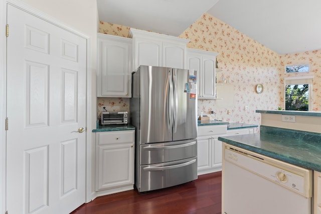 kitchen featuring freestanding refrigerator, dark wood finished floors, dishwasher, and wallpapered walls