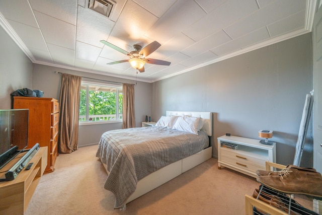 bedroom with light colored carpet, ornamental molding, a ceiling fan, and visible vents