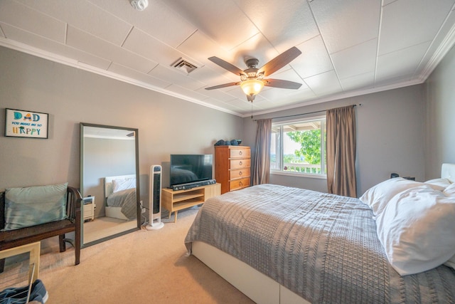 bedroom featuring visible vents, ornamental molding, a ceiling fan, and light colored carpet