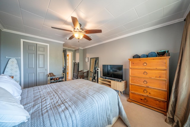bedroom with light colored carpet, ornamental molding, and a ceiling fan