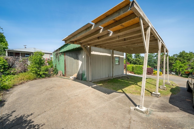 view of patio featuring an outbuilding