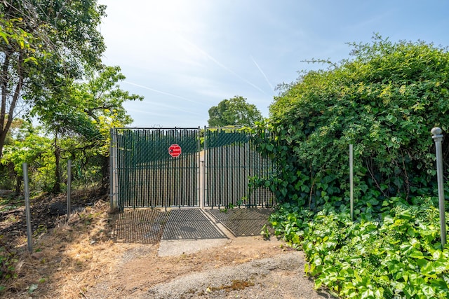view of gate featuring fence