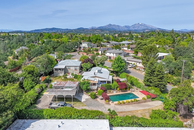 drone / aerial view featuring a residential view and a mountain view