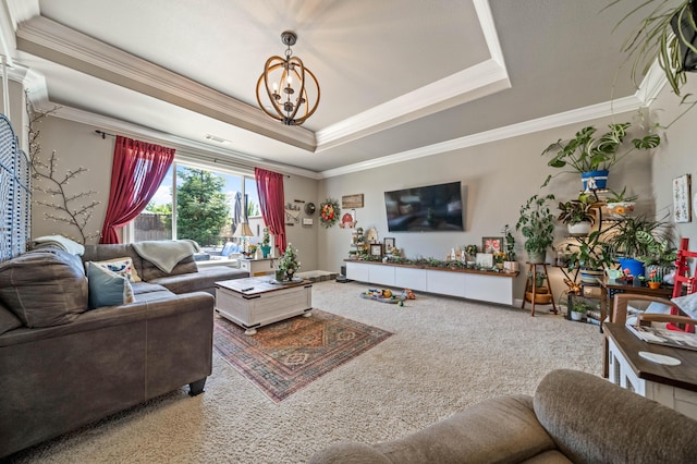 living room with crown molding, carpet floors, baseboards, a chandelier, and a tray ceiling
