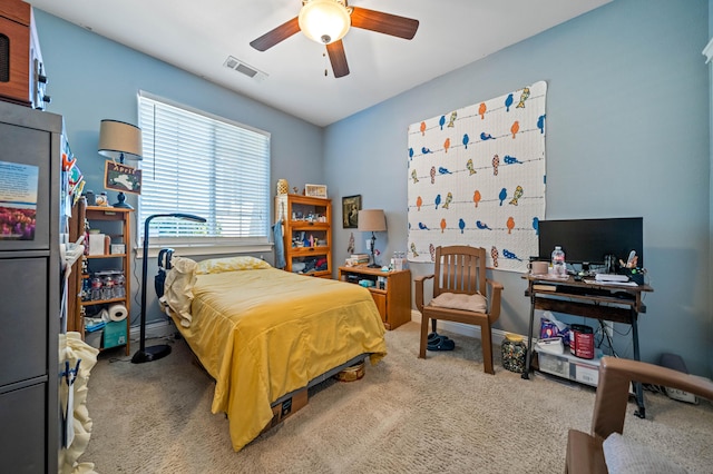 bedroom with a ceiling fan, visible vents, and carpet
