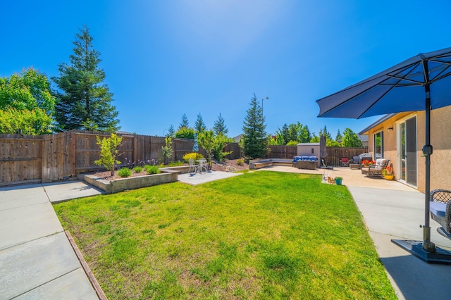 view of yard featuring outdoor lounge area, a fenced backyard, and a patio area