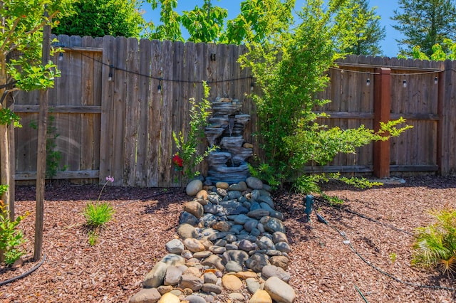 view of yard featuring fence
