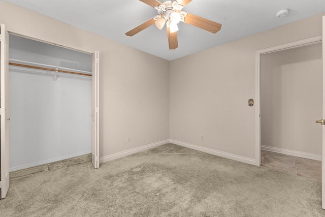 unfurnished bedroom with a ceiling fan, baseboards, carpet, and a closet