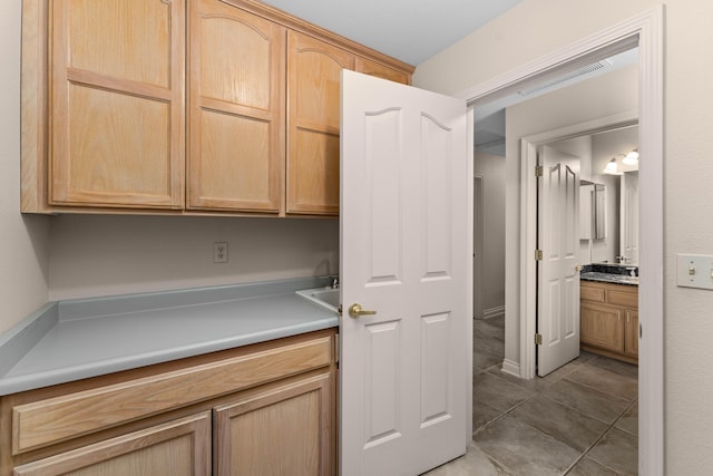 laundry room with light tile patterned floors
