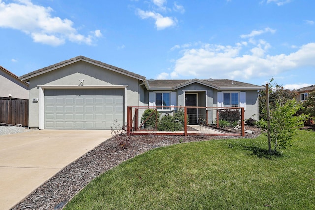 ranch-style house with fence, an attached garage, stucco siding, concrete driveway, and a front yard