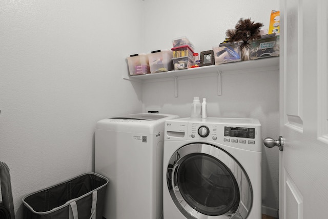 laundry room with washer and dryer and laundry area
