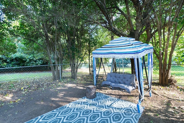 view of patio / terrace featuring fence