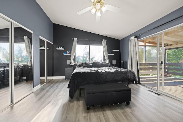 bedroom featuring visible vents, wood finished floors, access to exterior, ceiling fan, and vaulted ceiling