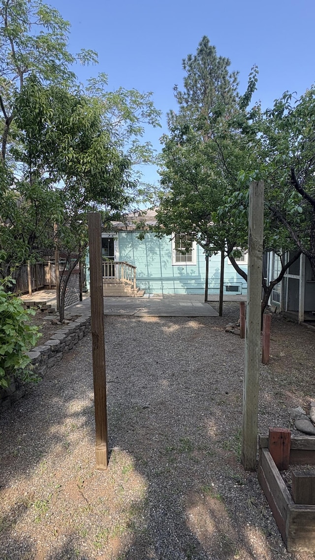 view of yard featuring a patio and fence