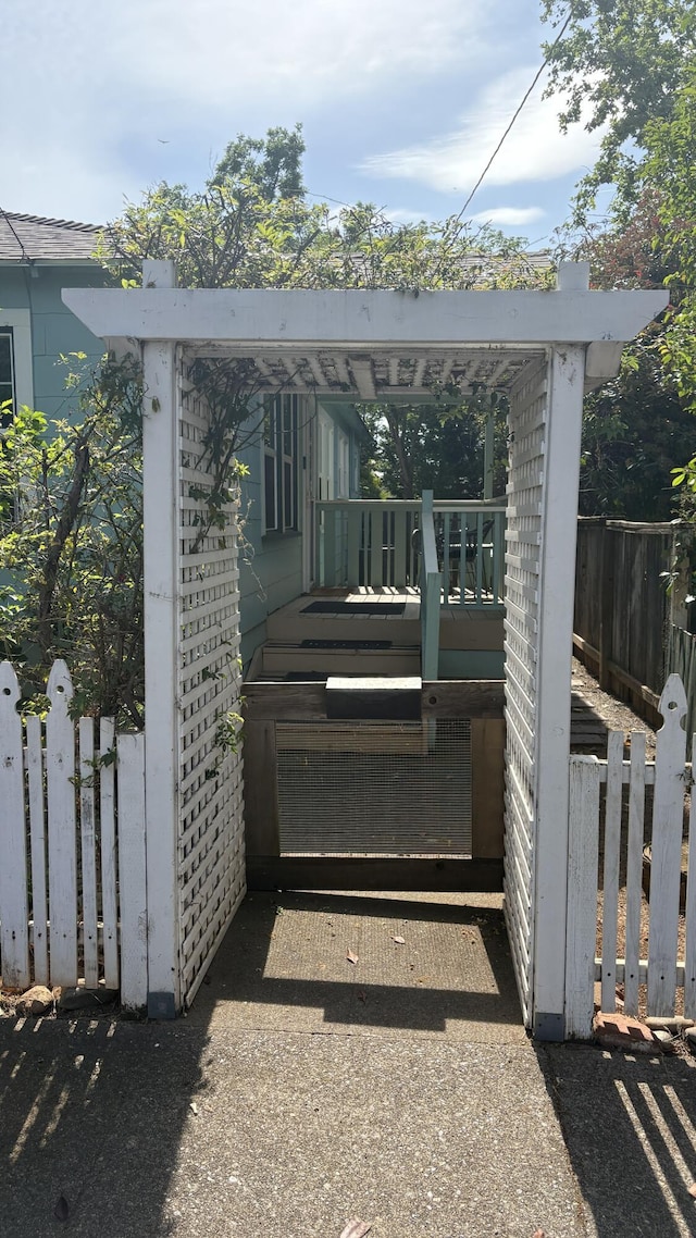 view of gate with fence