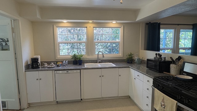 1020 E St, Redding, CA 96001 - kitchen featuring a sink, a healthy amount of sunlight, dishwasher, black microwave, and stainless steel gas range