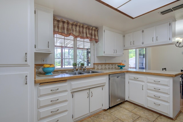 3140 Winding Way, Redding, CA 96003 - kitchen with visible vents, dishwasher, a sink, light countertops, and white cabinets