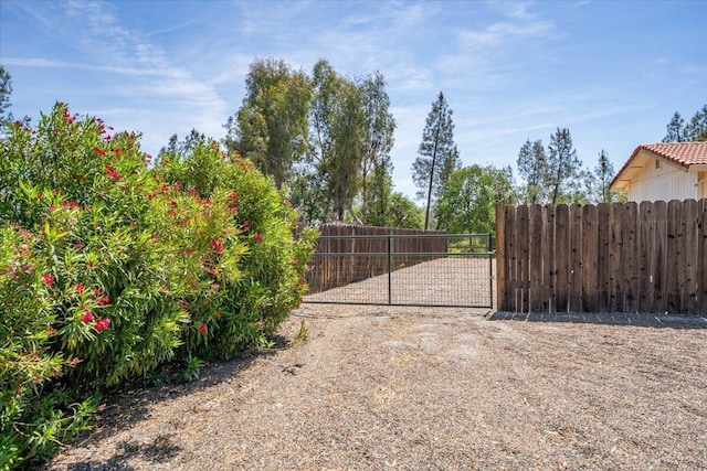 view of gate featuring fence
