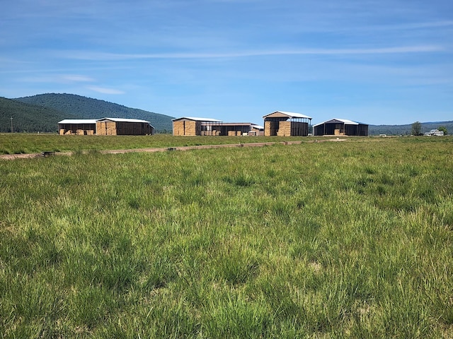 25653 Glenburn Rd, Fall River Mills, CA 96028 - view of yard with an outbuilding, an outdoor structure, and a mountain view