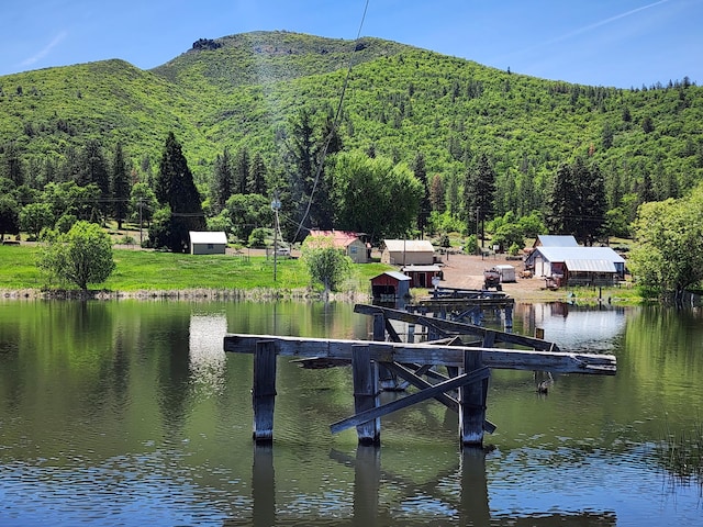 25653 Glenburn Rd, Fall River Mills, CA 96028 - dock featuring a forest view and a water and mountain view