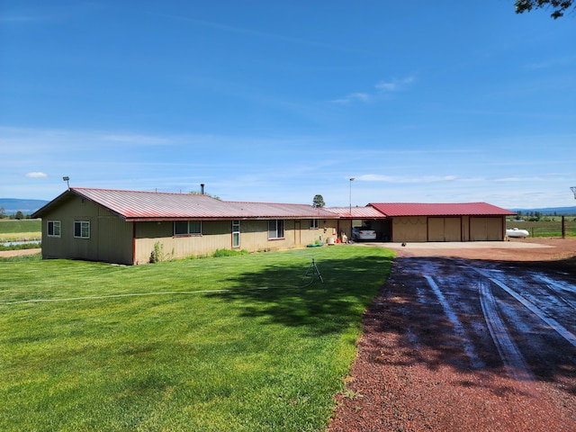 25653 Glenburn Rd, Fall River Mills, CA 96028 - view of front facade with a front lawn, metal roof, and driveway