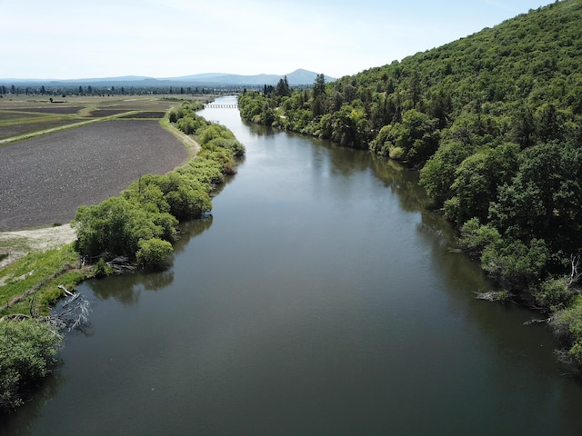 25653 Glenburn Rd, Fall River Mills, CA 96028 - drone / aerial view of a water and mountain view and a forest