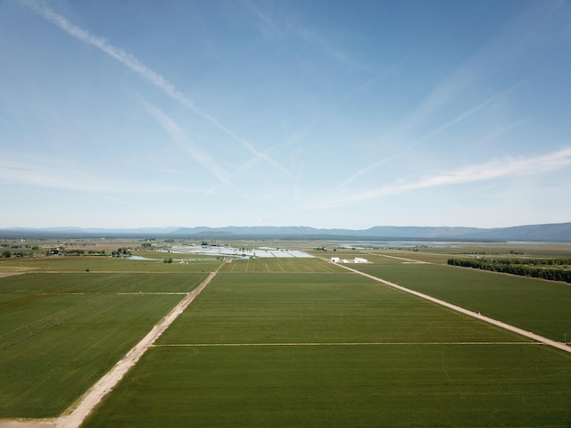 25653 Glenburn Rd, Fall River Mills, CA 96028 - aerial view of sparsely populated area featuring a mountain backdrop and rows of crops
