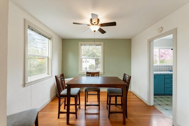 979 Lassen Ln, Mount Shasta, CA 96067 - dining room featuring a ceiling fan, baseboards, and light wood-style flooring