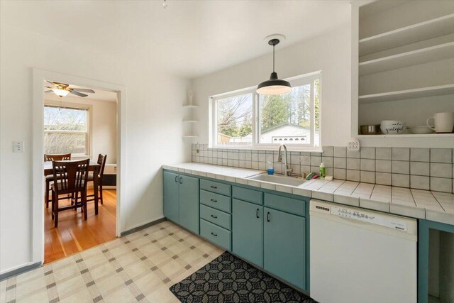 979 Lassen Ln, Mount Shasta, CA 96067 - kitchen featuring tasteful backsplash, open shelves, dishwasher, a sink, and tile counters