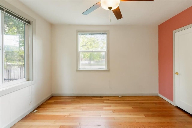 979 Lassen Ln, Mount Shasta, CA 96067 - unfurnished room featuring a ceiling fan, baseboards, plenty of natural light, and light wood-type flooring