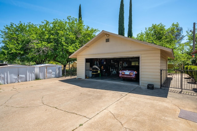 detached garage with fence
