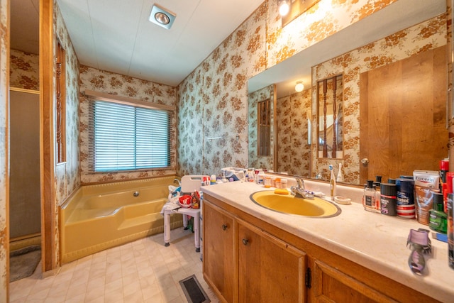full bathroom with wallpapered walls, a stall shower, vanity, and a bath