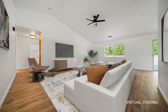 14556 Ryan Ln, Red Bluff, CA 96080 - living room featuring visible vents, baseboards, lofted ceiling, and wood finished floors